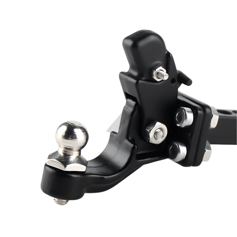 Close-up of a black metal trailer hitch with silver ball on a white background